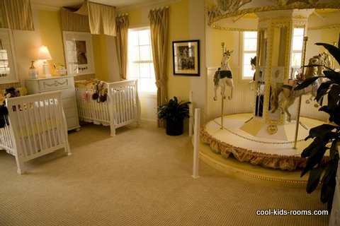 Luxury beige and yellow colored nursery for twins with carousel